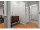 Elegant entry with hardwood floors and arched doorway features decorative chest with storage at 1850 Cotillion Dr # 3215, Atlanta, GA 30338