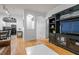 Inviting living room features hardwood floors, neutral paint, and an entertainment center with storage at 1850 Cotillion Dr # 3215, Atlanta, GA 30338