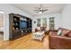 Comfortable living room with hardwood floors, leather seating, ceiling fan, and natural light at 1850 Cotillion Dr # 3215, Atlanta, GA 30338