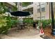 Outdoor patio space, complete with grill, seating and umbrella for a relaxing experience at 1850 Cotillion Dr # 3215, Atlanta, GA 30338
