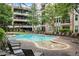 Resort-style pool area with lounge chairs and a view of the building at 1850 Cotillion Dr # 3215, Atlanta, GA 30338
