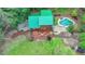 Birds-eye view of backyard with a pool, deck and an in-ground garden at 2864 Winder Hwy, Dacula, GA 30019