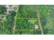 Aerial view of a secluded property featuring a home, pool, and lush greenery at 2864 Winder Hwy, Dacula, GA 30019