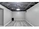 Basement with newly installed floors and painted walls providing a clean and bright space to be finished at 2864 Winder Hwy, Dacula, GA 30019
