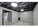 Basement with new flooring, painted walls, and an open ceiling ready for new finishes and versatile use at 2864 Winder Hwy, Dacula, GA 30019
