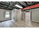 Basement with new floors, painted walls and ceilings, offering flexibility for a recreational area or additional bedroom at 2864 Winder Hwy, Dacula, GA 30019