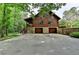 Beautiful log cabin style home with a large parking area and stone facade at 2864 Winder Hwy, Dacula, GA 30019