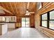 Bright kitchen has white cabinets and stainless appliances next to the open living room at 2864 Winder Hwy, Dacula, GA 30019