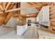 Open kitchen has white cabinets, island, and stainless appliances at 2864 Winder Hwy, Dacula, GA 30019