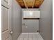 Laundry room with tiled floors and hanging cabinets at 2864 Winder Hwy, Dacula, GA 30019