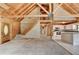 Open floor plan with staircase to loft, log walls, and kitchen with island at 2864 Winder Hwy, Dacula, GA 30019