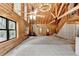 Spacious living room features high ceilings, log walls, and staircase at 2864 Winder Hwy, Dacula, GA 30019