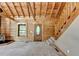 Log cabin interior featuring a carpeted living room with wood walls and a wood burning stove at 2864 Winder Hwy, Dacula, GA 30019