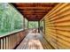 Relaxing porch view with a swing, wood flooring, and a serene view of surrounding lush greenery at 2864 Winder Hwy, Dacula, GA 30019