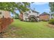 Large, well-maintained backyard with lush green lawn and privacy fence at 4045 Bonnett Creek Ln, Hoschton, GA 30548