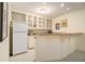 Finished basement bar includes display cabinets, a sink, and a mini-refrigerator at 4045 Bonnett Creek Ln, Hoschton, GA 30548