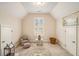 Bedroom featuring an armchair, natural light, neutral carpet and two entry doors at 4045 Bonnett Creek Ln, Hoschton, GA 30548