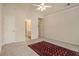 Bedroom with neutral walls and floors and access to an ensuite bathroom at 4045 Bonnett Creek Ln, Hoschton, GA 30548