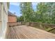 Wooden deck with railing overlooking the backyard at 4045 Bonnett Creek Ln, Hoschton, GA 30548