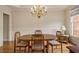 Elegant dining room with hardwood floors and a chandelier at 4045 Bonnett Creek Ln, Hoschton, GA 30548