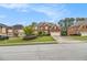 Charming two-story brick home with manicured lawn, driveway, and well-maintained landscaping at 4045 Bonnett Creek Ln, Hoschton, GA 30548