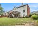Two-story home with a deck, a walkout basement, and a well-maintained lawn at 4045 Bonnett Creek Ln, Hoschton, GA 30548