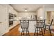 Modern kitchen featuring stainless steel appliances and a breakfast bar with seating at 4045 Bonnett Creek Ln, Hoschton, GA 30548