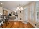 Bright kitchen with white cabinetry, hardwood floors and open layout at 4045 Bonnett Creek Ln, Hoschton, GA 30548