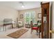 Comfortable sitting room with a neutral color palette, area rug, and natural light from the windows at 4045 Bonnett Creek Ln, Hoschton, GA 30548
