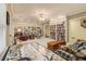 Expansive living room with custom shelves, multiple seating arrangements and ceiling fan at 4045 Bonnett Creek Ln, Hoschton, GA 30548