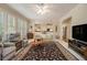 Bright living area with large windows and neutral decor at 4045 Bonnett Creek Ln, Hoschton, GA 30548
