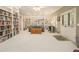 Spacious living room features custom built-in bookshelves and lots of seating at 4045 Bonnett Creek Ln, Hoschton, GA 30548