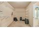 Spacious walk-in closet with adjustable shelving, carpet, and a window for natural light at 4045 Bonnett Creek Ln, Hoschton, GA 30548