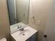 A bathroom featuring a single sink with a mirror above it at 1165 Oaks Pl, Stone Mountain, GA 30083