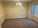 Bright dining room with chair rail, chandelier and multiple windows at 1165 Oaks Pl, Stone Mountain, GA 30083