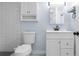 A modern bathroom featuring a white vanity and toilet, complemented by a subway tile shower at 1824 Atherton Dr, Decatur, GA 30035
