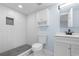 A beautifully remodeled bathroom with a tiled walk-in shower, and updated vanity at 1824 Atherton Dr, Decatur, GA 30035
