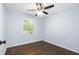 A clean bedroom featuring beautiful hardwood floors and a ceiling fan at 1824 Atherton Dr, Decatur, GA 30035
