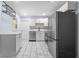 Renovated kitchen featuring stainless steel appliances, updated white cabinets and stone countertops at 1824 Atherton Dr, Decatur, GA 30035