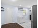 Bright kitchen with marble tile flooring, stainless steel appliances, and sleek white cabinetry at 1824 Atherton Dr, Decatur, GA 30035