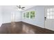 Well-lit living room featuring beautiful hardwood floors and access to other rooms at 1824 Atherton Dr, Decatur, GA 30035