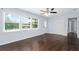 Bright living room with beautiful hardwood floors, neutral paint, and a ceiling fan for added comfort at 1824 Atherton Dr, Decatur, GA 30035