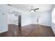 Bright living room featuring hardwood floors, a ceiling fan, and natural light from several windows at 1824 Atherton Dr, Decatur, GA 30035
