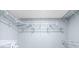 Organized walk-in closet with comprehensive shelving system for optimal storage at 1824 Atherton Dr, Decatur, GA 30035