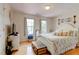 Cozy bedroom featuring wood floors, a decorative headboard, and natural light at 2707 Mariner Way, Villa Rica, GA 30180