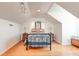 Cozy bedroom featuring wood floors, a bed, and ambient lighting from two lamps at 2707 Mariner Way, Villa Rica, GA 30180