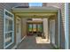 Covered outdoor entrance with a glass door and sidelights, offering a bright and welcoming space at 2707 Mariner Way, Villa Rica, GA 30180