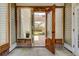Inviting entrance featuring a decorative glass door, sidelight windows and brick accents at 2707 Mariner Way, Villa Rica, GA 30180