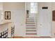 Hardwood staircase with white risers and railing at 2707 Mariner Way, Villa Rica, GA 30180