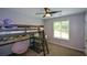 Comfortable bedroom with bunk beds, a ceiling fan, and a window at 3217 New Rutledge Nw Rd, Kennesaw, GA 30152